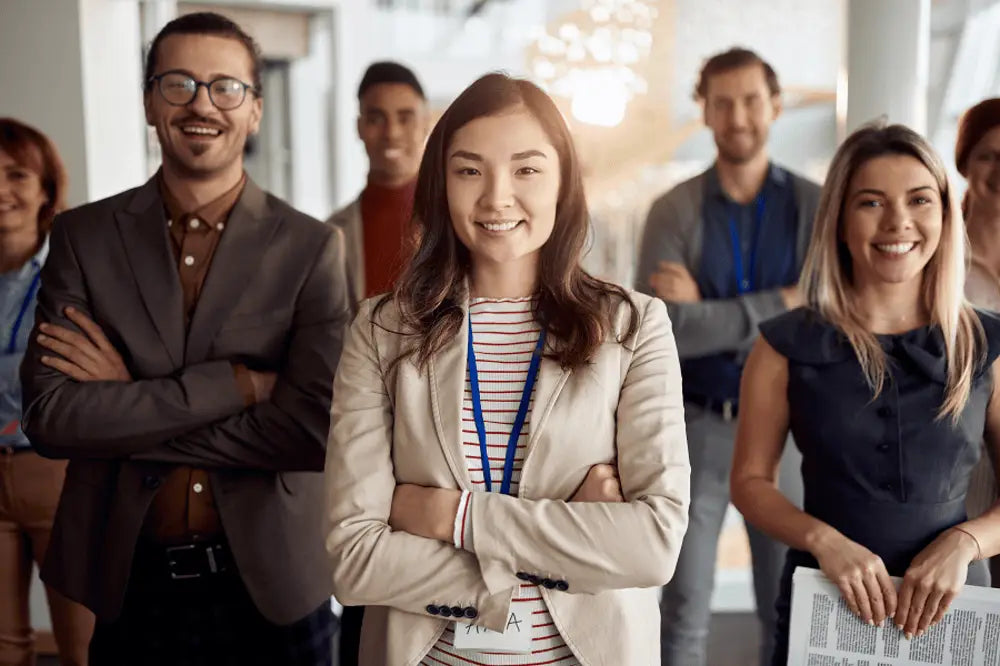Woman in beige blazer at trade show professionals swear by