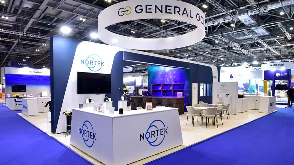 White and blue Nortek booth with circular logo signage at successful trade show
