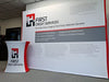 White and red First Credit Services branded cup on 10ft straight pop up fabric display