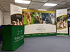 Green 10ft straight pop up fabric display table with holiday house logo