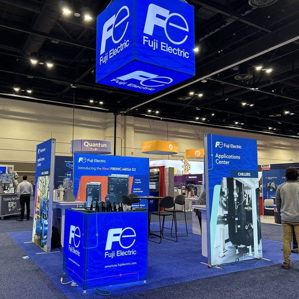 Blue illuminated Fuji Electric cube sign in 10x10 frameless SEG lightbox