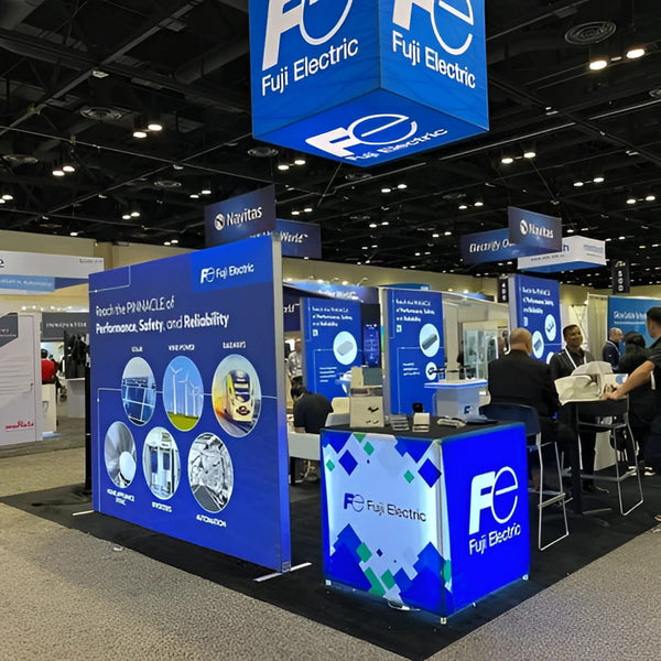 Blue illuminated Fujitsu trade show booth with geometric patterns