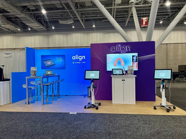 Purple and blue Align branded display wall with dental aligner screens in 10x10 Frameless SEG Lightbox TV Display Kit 03