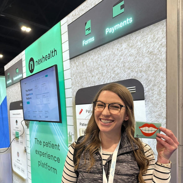 Smiling woman holds green Smiley Mouth card in 10x10 SEG Lightbox Kit