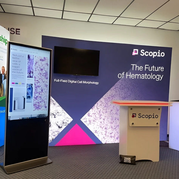 Scopio podium with beige finish and orange trim in 10x10 SEG lightbox