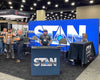 Blue Stan logo on 20ft backlit SEG light box wall panel