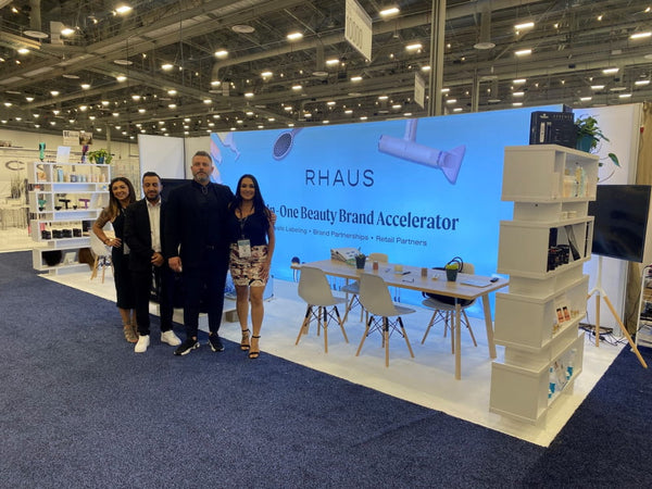 Modern white minimalist shelf unit in 20ft backlit SEG light box wall