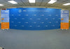 Blue curved backdrop with PPIC logo and text for Public Policy Institute of California on 20ft straight pop up display