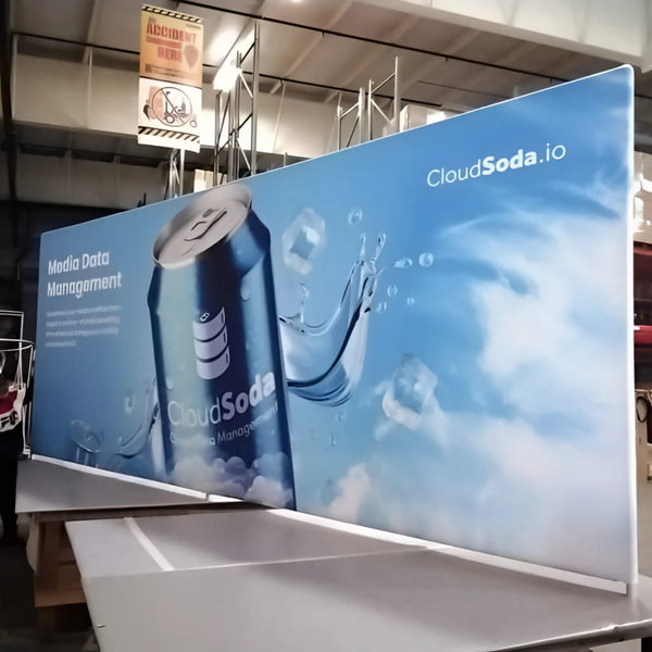 Blue soda can with silver tab on 20ft tension fabric display