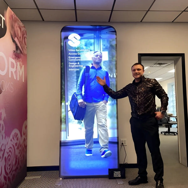 Sleek 3ft backlit tension fabric display with illuminated man in blue attire