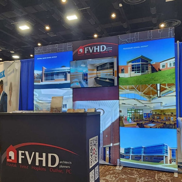Black FVHD Architects Planners booth with red white logo in 3ft frameless SEG lightbox