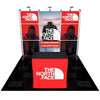 Red North Face trade show booth on 3ft shelving stand with black mannequin