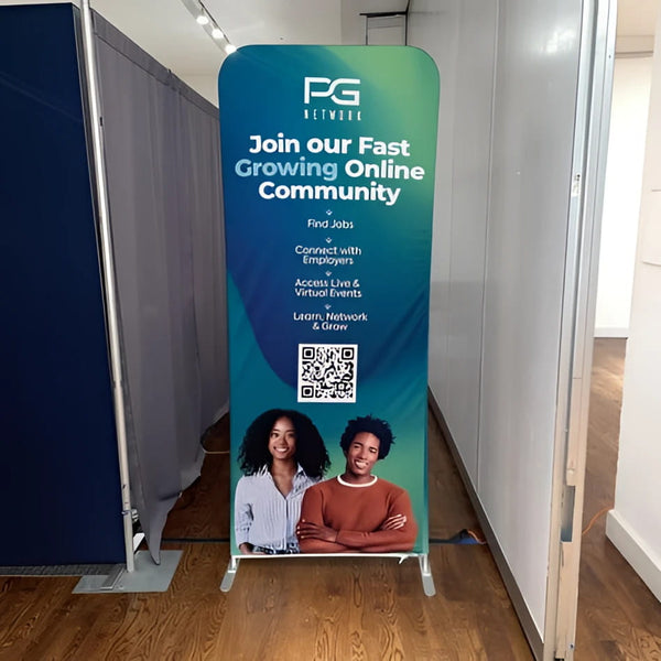 Tall teal blue gradient 3ft tension fabric banner with PG Network logo, QR code, smiling professionals
