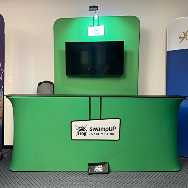 5ft tension fabric banner stand with green booth, TV and signage