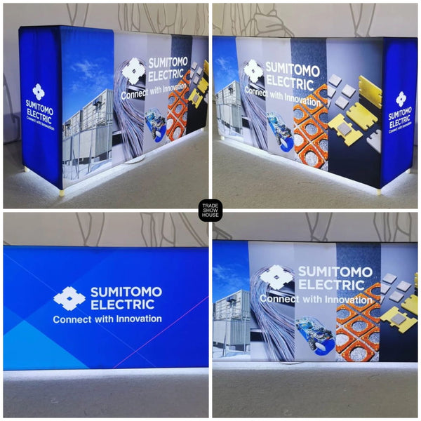 Blue and gray illuminated Sumitomo Electric trade show booth with Connect with Innovation slogan