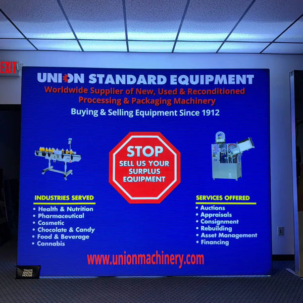 Blue digital screen on 8ft backlit SEG light box wall advertising Union Standard equipment services