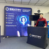 Blue glowing circular interface on Sentry Enterprises identity protection banner in 8ft backlit display
