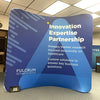 8ft Curved Tension Fabric Display Kit with blue banner, white text, diagonal patterns