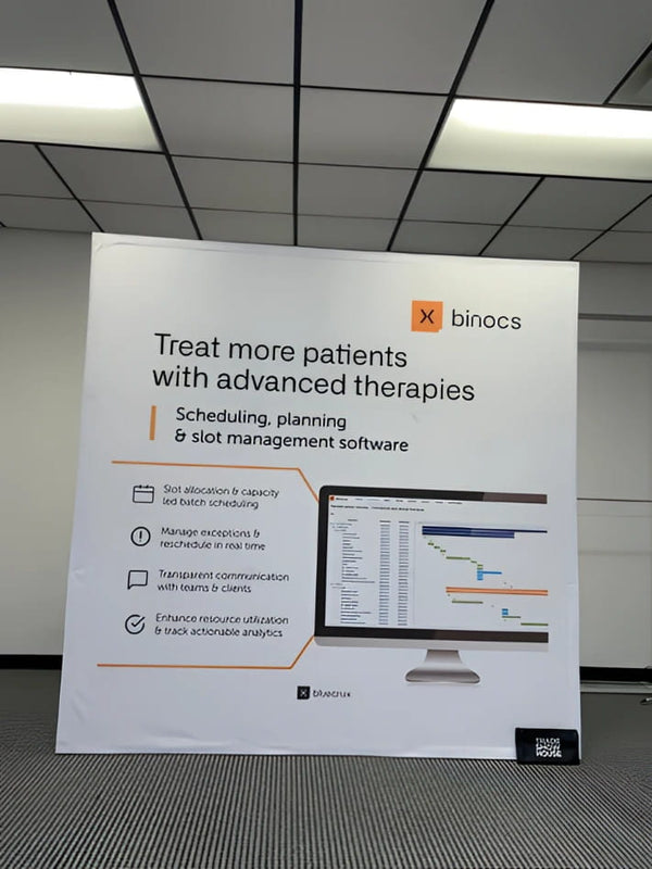 White Binocs scheduling software promo banner on 8ft pop up display