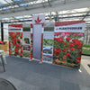 Plantpeddler 8ft Straight Tension Fabric Display with vibrant floral panels