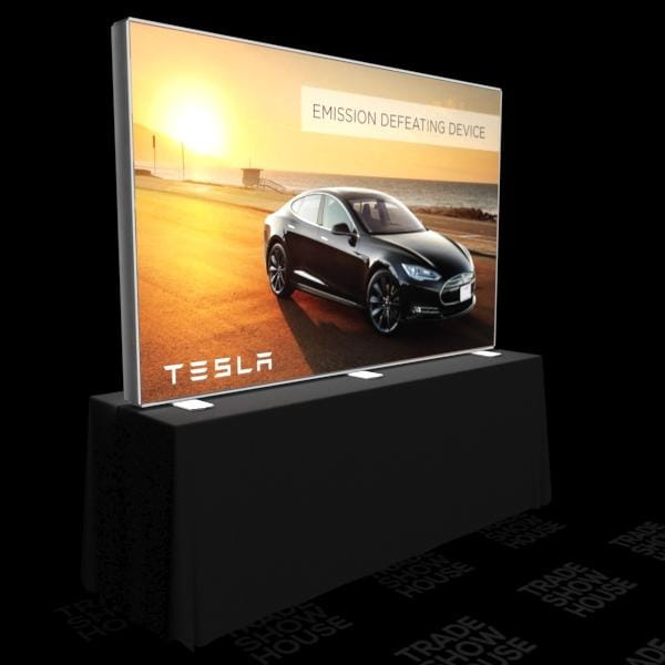 Black Tesla Model S on illuminated SEG display with emission defating device text