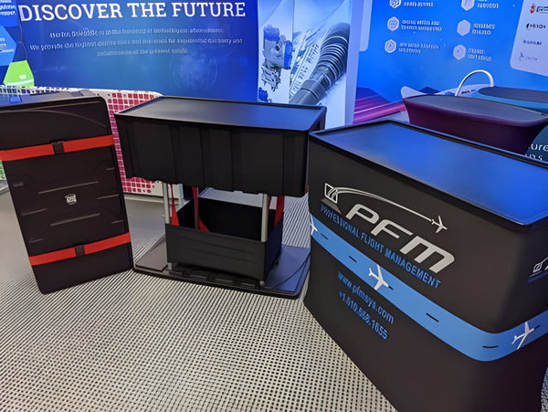 Black PFM display stand with blue-white branding in C700 case