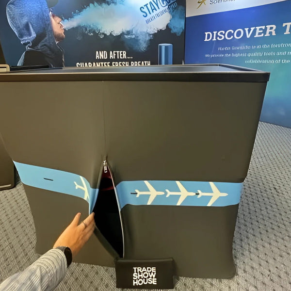 Dark gray C700 hard shipping case booth with light blue airplane stripes and zipper opening