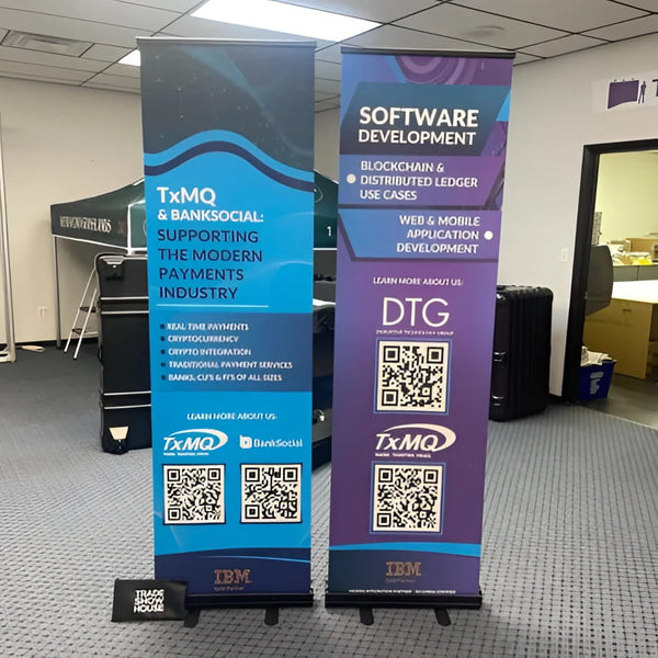 Two Classic 24 Inch retractable banner stands with blue-purple banners in office