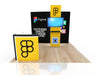 Yellow display stand with black logo and screen in 10x20 Eco-Modular Backlit TV Exhibit Kit 38