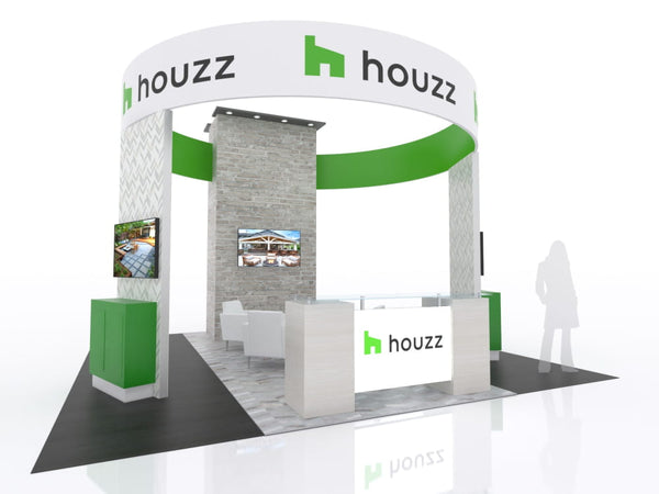 White and green Houzz booth with stone walls, digital displays, signage