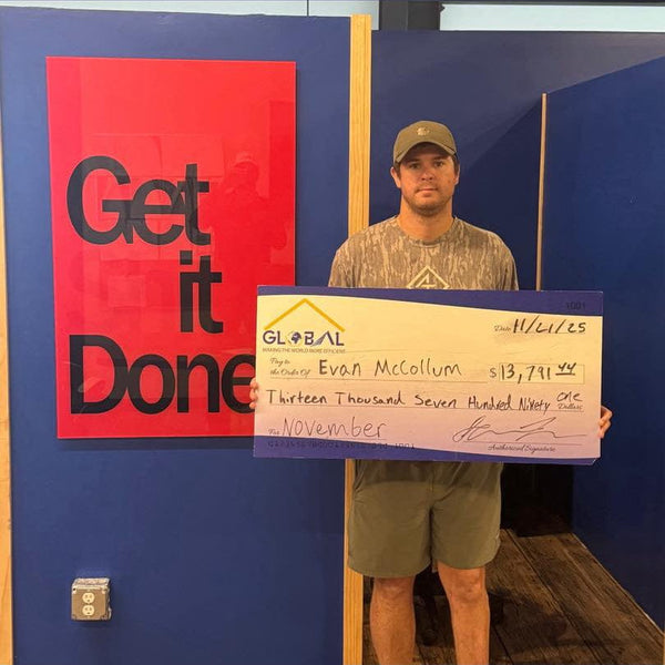 Mounted poster of $13,791 check payable to Evan McCollum