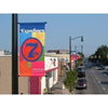 Vibrant multicolored 7th outdoor pole banner with bold blue red circular design