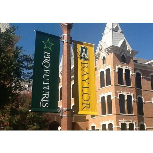 Green and yellow outdoor pole banners with Profuturus and Baylor text
