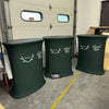 Three dark green stretchy fabric-covered pop up hydraulic podiums with Wyld Good Tide logos and antler designs