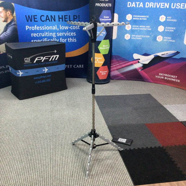 Silver tripod stand with multi-bar arm for garment rack mounting