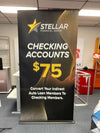 Black and gold retractable banner for Stellar Financial Group checking accounts at $75