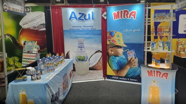 Blue and white Azul and Mira branded beverage display on premium 48-inch retractable banner stand
