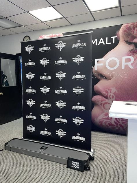 Black Amerhar Tequila retractable banner stand with white logo pattern
