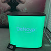 Sleek green glowing DeNovix display on black-topped Rectangle Backlit Inflatable Counter