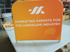 Orange banner on Small Half Wall Barrier Display: marketing experts for landscape industry
