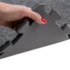 Black interlocking foam mat with fuzzy edges for trade show flooring