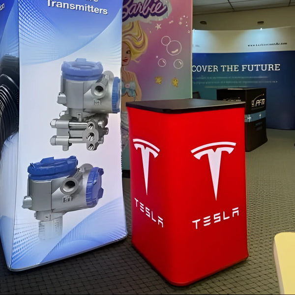 Red Tesla branded display stand on Square Backlit Inflatable Counter