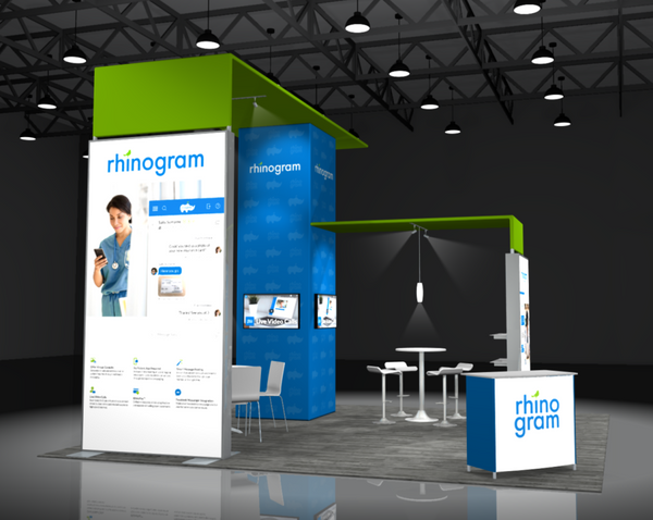 Healthcare professional using smartphone at blue green rhinogram Sync 2-in-1 Backlit Hybrid Island Exhibit Kit K booth