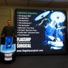 Blue illuminated flagship surgical mat on Triangle Backlit Inflatable Counter stand