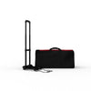 Black rolling suitcase with red trim and sturdy handle for travel