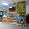 Rustic wooden wall with Tide Water Grain logo and ag photos for VESA mount