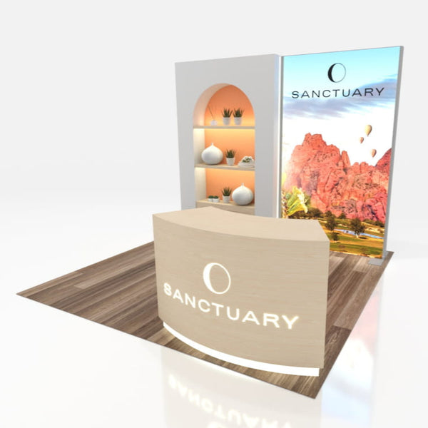 Beige curved exhibition counter with Sanctuary logo and arched shelving in 10x10 VHE-Modular Inline Exhibit Kit 09a