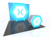 Blue hexagonal Xamarin stands with white x logo in 10x10 VHE modular kit