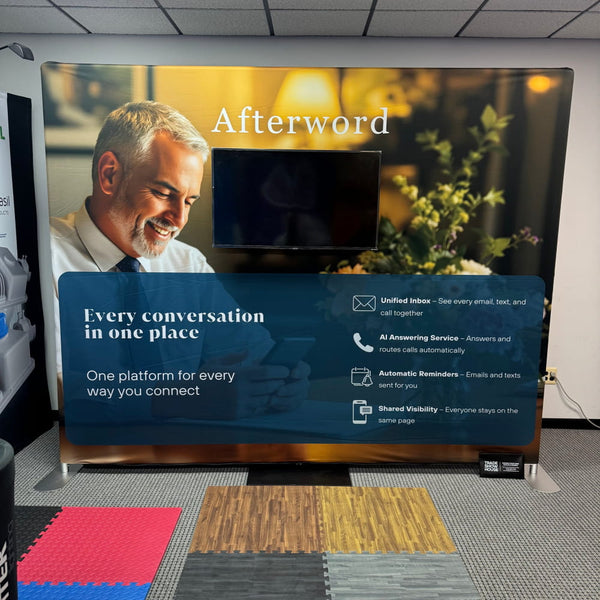 Afterword brand banner on W2 TV stand: smiling man in white shirt, tie, warm background, communication features