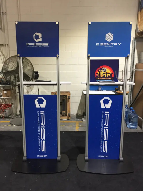 Two X6 Freestanding TV Monitor Stands with blue branding and silver frames